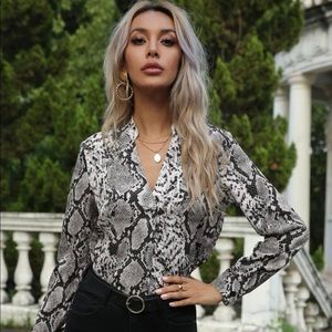Snakeskin print notched neck blouse